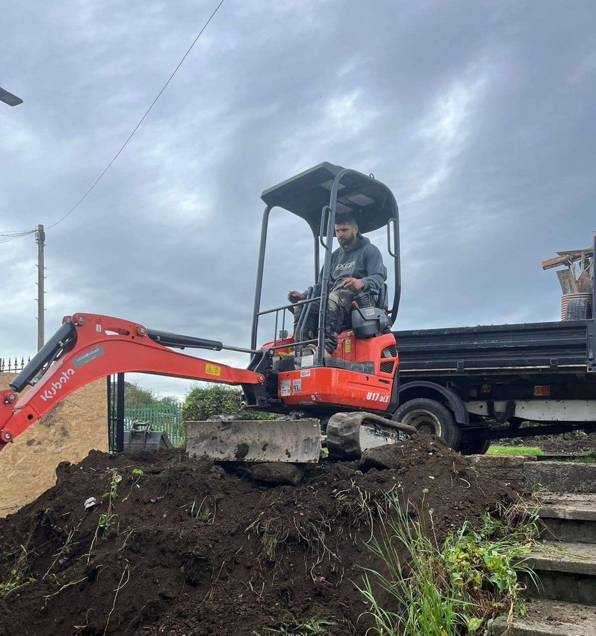 Paulin operating a Kubota mini-excavator on the Doncaster build